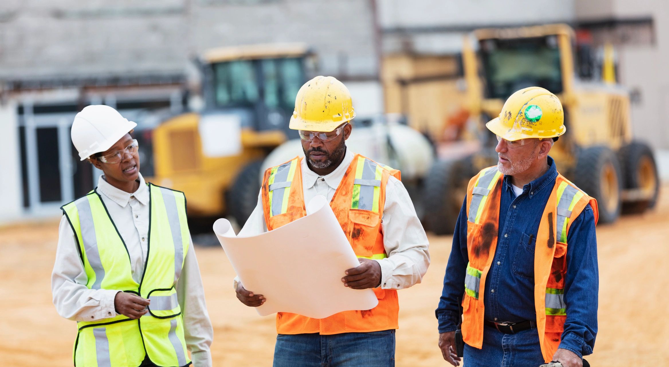 Construction workers conversing at a job site