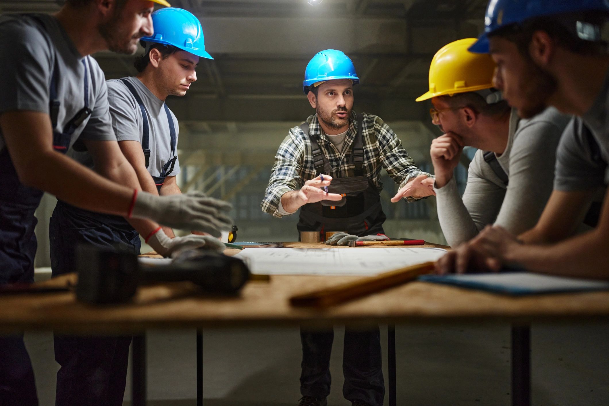 Construction team reviewing plans on site